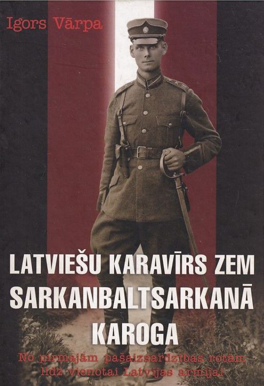 Latviešu karavīrs zem sarkanbaltsarkanā karoga