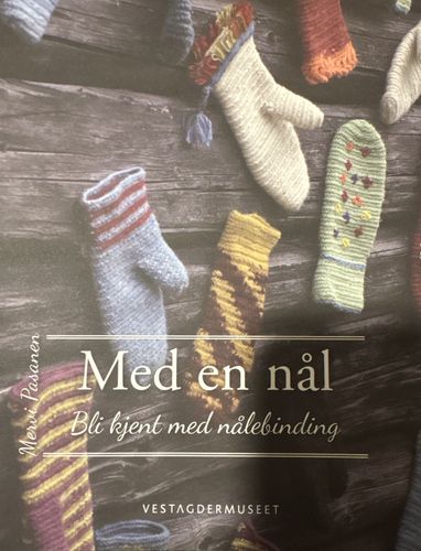 Med en nål